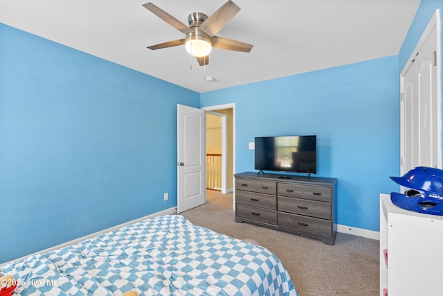 bedroom featuring ceiling fan, carpet flooring, and baseboards