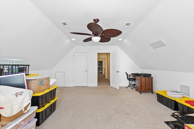 interior space with carpet floors, lofted ceiling, visible vents, and a ceiling fan