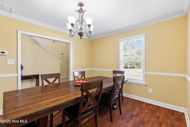 dining area with dark wood-style floors, baseboards, visible vents, and crown molding