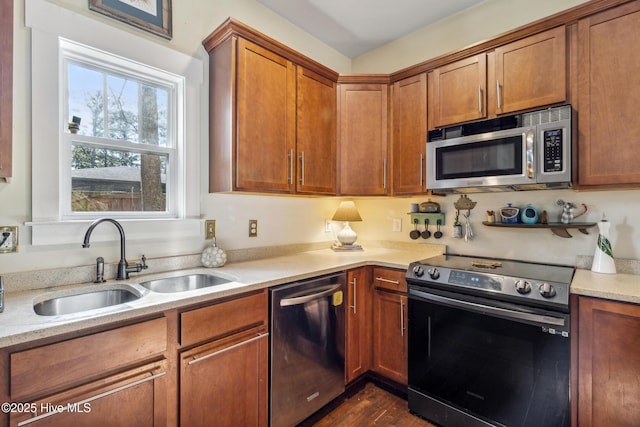 kitchen with sink, dark hardwood / wood-style floors, and appliances with stainless steel finishes