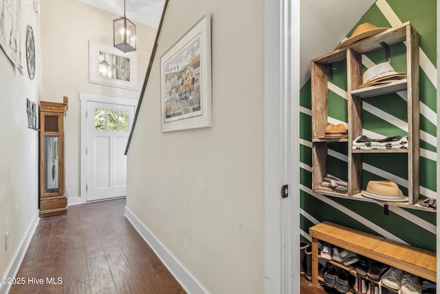 corridor featuring dark wood-type flooring