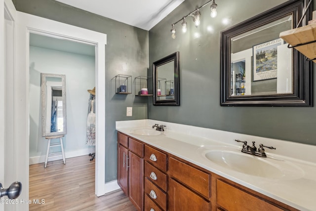 bathroom featuring vanity and hardwood / wood-style floors