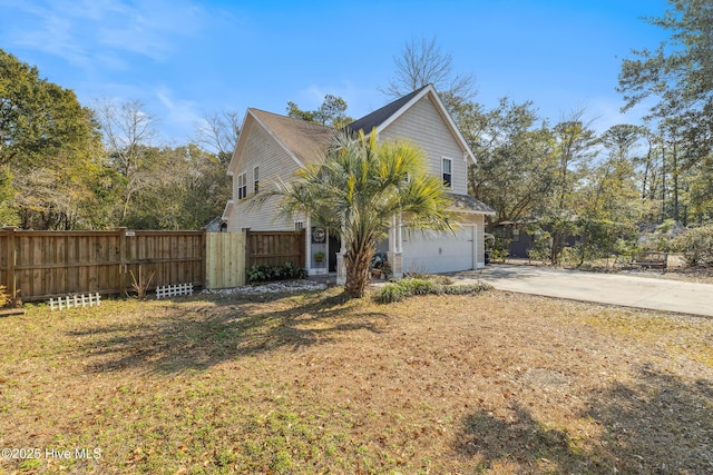 view of side of property with a garage