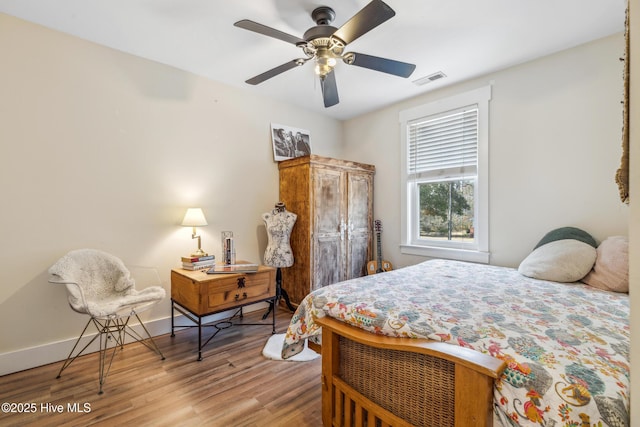 bedroom featuring hardwood / wood-style flooring and ceiling fan