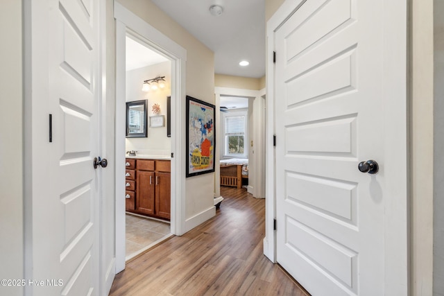 hall with light hardwood / wood-style flooring