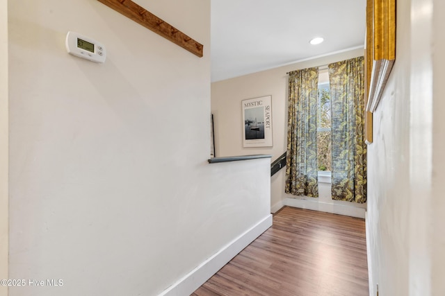 hallway featuring hardwood / wood-style flooring and a wealth of natural light