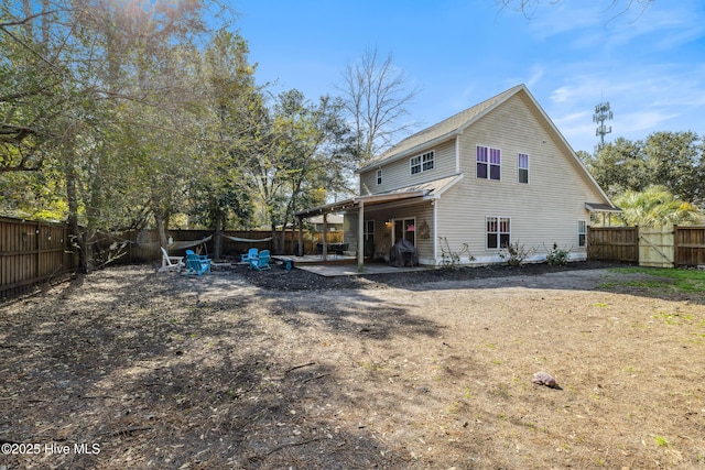 back of house with a patio area