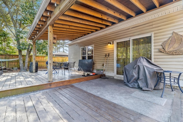 wooden terrace with a grill