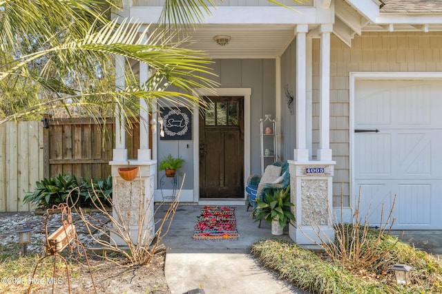 doorway to property with a garage