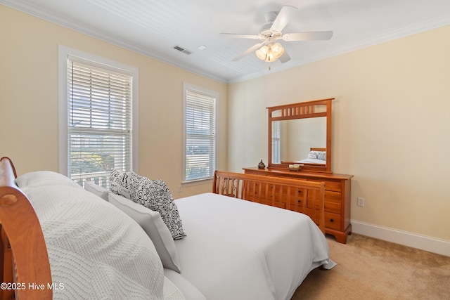 bedroom featuring ceiling fan, ornamental molding, and light carpet