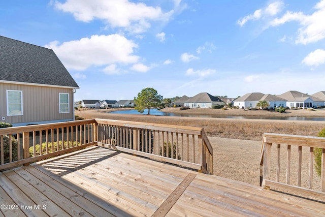 wooden deck with a water view