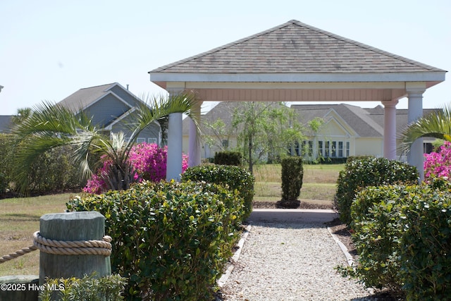 exterior space featuring a gazebo and a yard