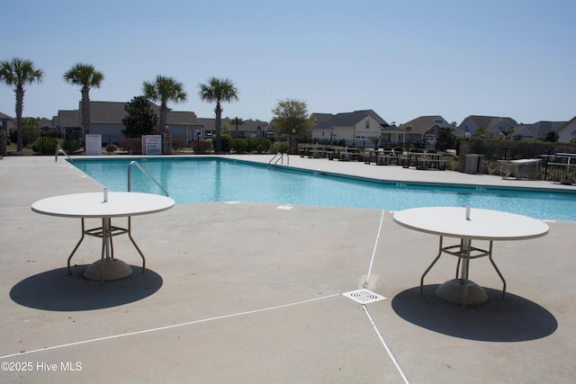 view of swimming pool with a patio