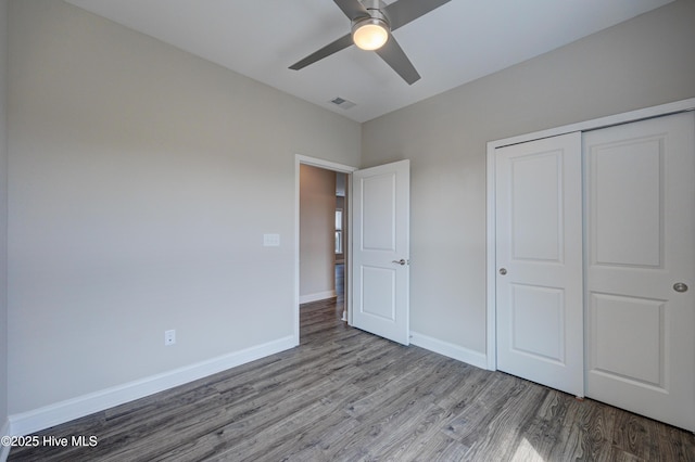 unfurnished bedroom featuring a closet, ceiling fan, and light hardwood / wood-style flooring