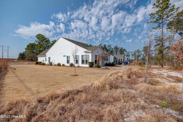 view of side of home featuring a lawn