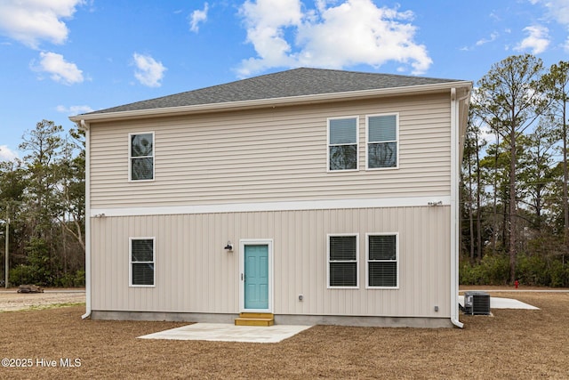 back of house featuring cooling unit and a patio