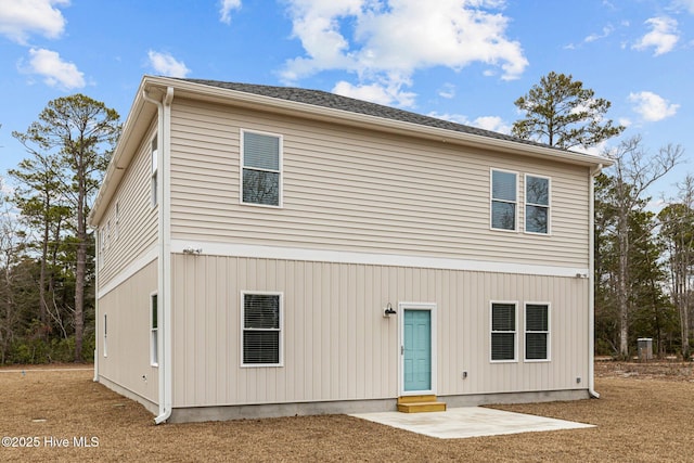 back of house with a patio