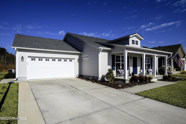 view of front of property with a garage and covered porch