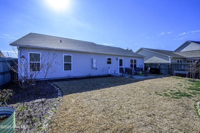 back of property with a patio