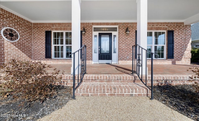 property entrance featuring a porch