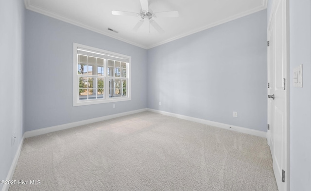 empty room with crown molding, ceiling fan, and light carpet