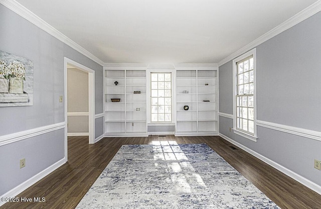 foyer entrance with dark wood-type flooring and ornamental molding