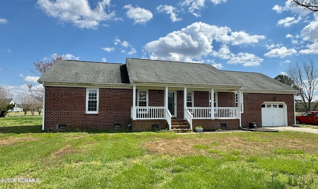 view of front of house with a garage, a front yard, and a porch