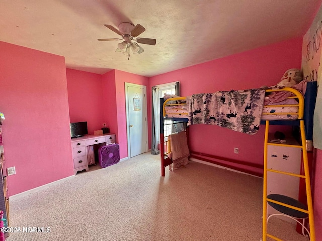 bedroom featuring ceiling fan and carpet