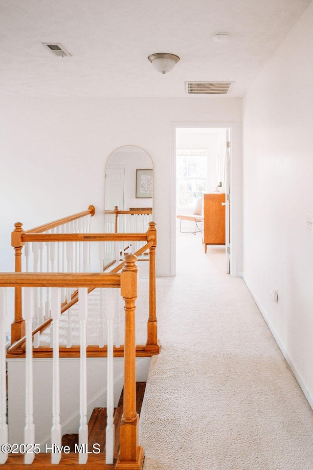 hall with carpet flooring