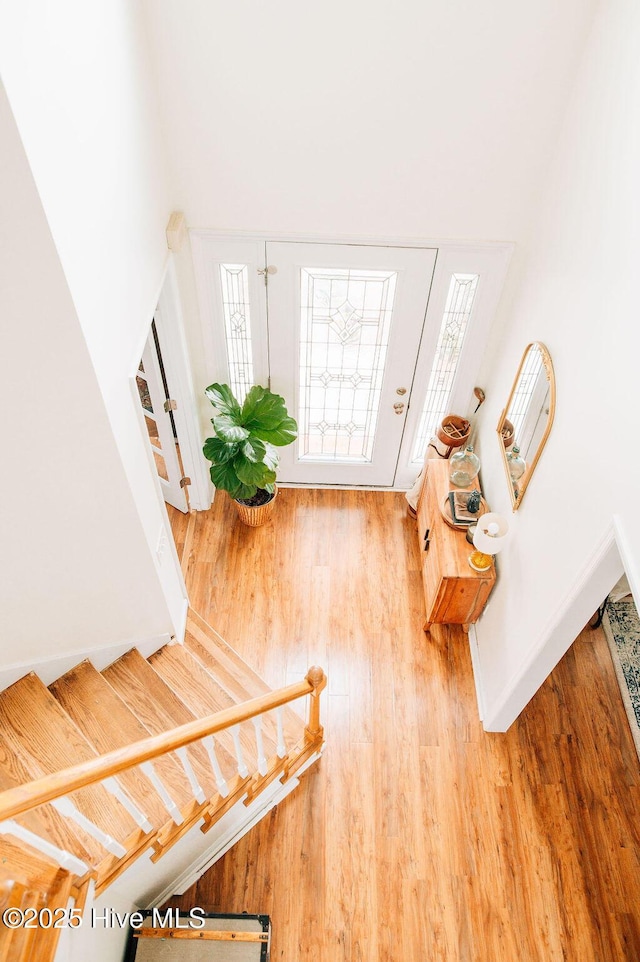 entryway with hardwood / wood-style floors