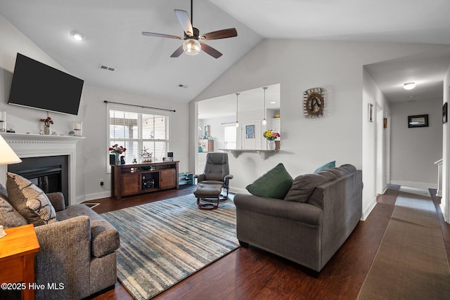 living room featuring ceiling fan, high vaulted ceiling, and dark hardwood / wood-style flooring