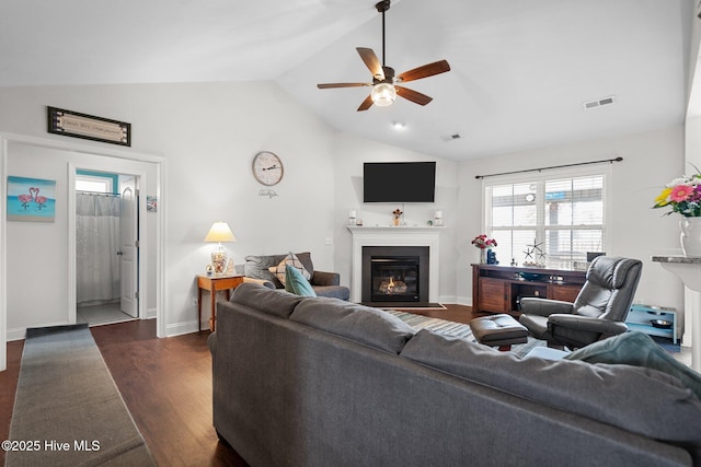 living room featuring lofted ceiling, dark hardwood / wood-style floors, and ceiling fan