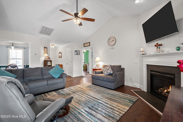 living room with high vaulted ceiling, dark hardwood / wood-style floors, and ceiling fan