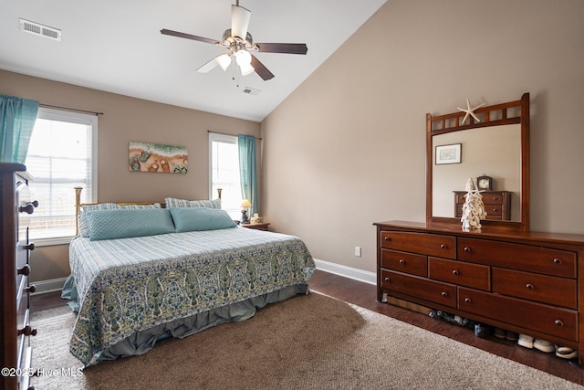 bedroom featuring lofted ceiling, dark wood-type flooring, and ceiling fan