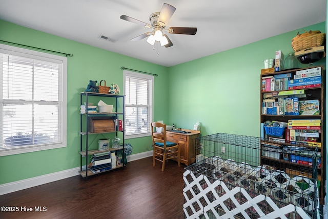 bedroom with dark wood-type flooring and ceiling fan