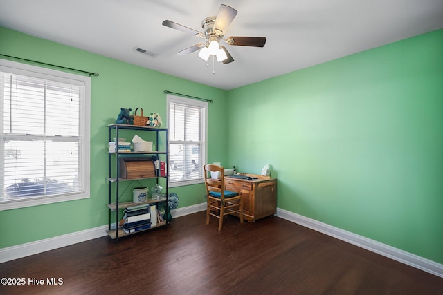 office area with ceiling fan and dark hardwood / wood-style flooring