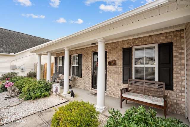 property entrance with covered porch