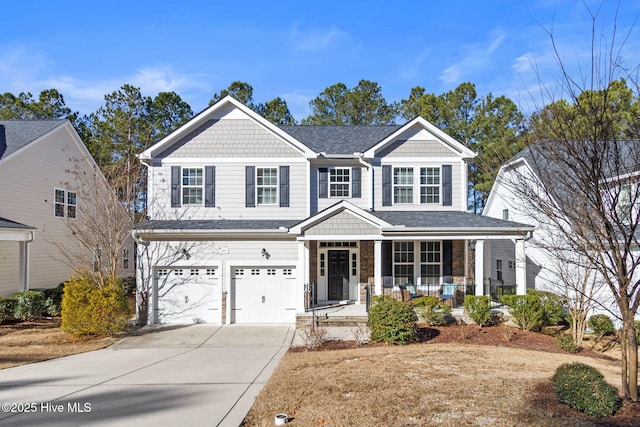 view of front of home featuring a garage and covered porch