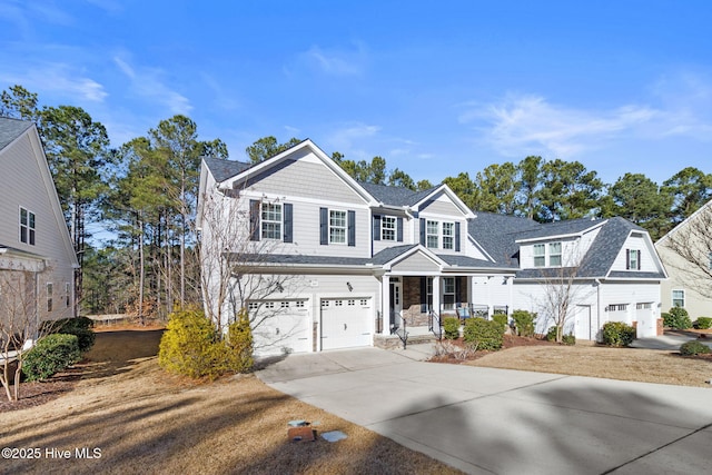 view of front property with a porch and a garage