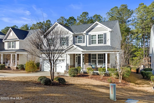 view of front of house with a garage and covered porch