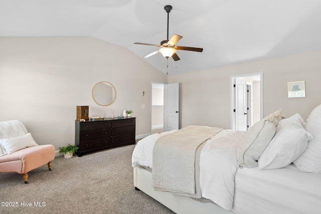 carpeted bedroom with ceiling fan and vaulted ceiling