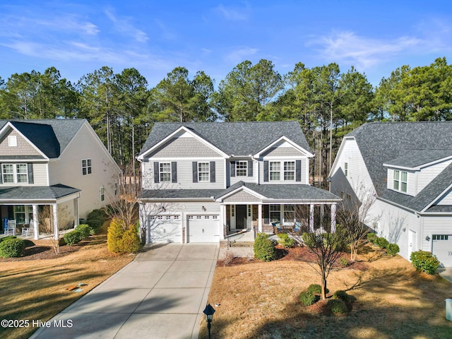 view of front of property featuring a garage and a porch