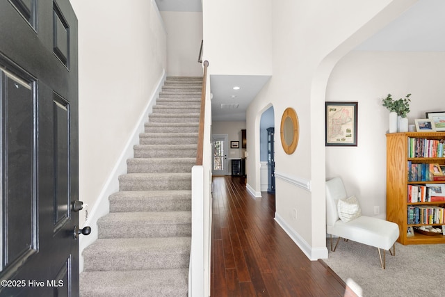 entrance foyer with dark hardwood / wood-style floors