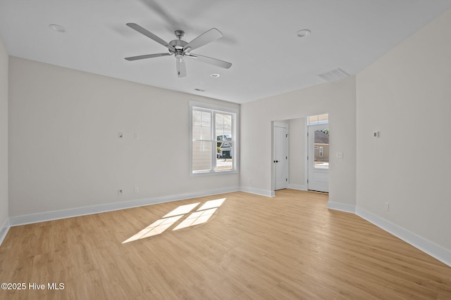 empty room featuring ceiling fan and light wood-type flooring