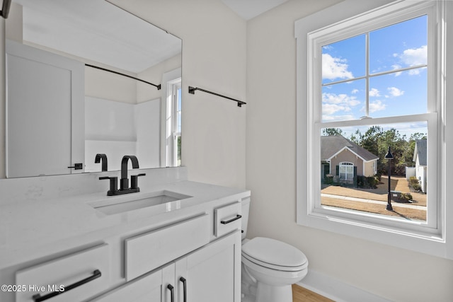 bathroom with vanity and toilet