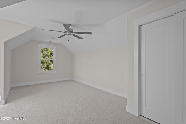 bonus room featuring vaulted ceiling, light colored carpet, and ceiling fan