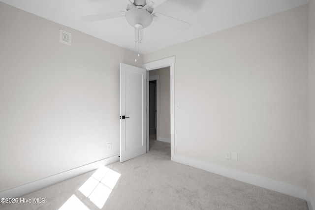 carpeted empty room with ceiling fan