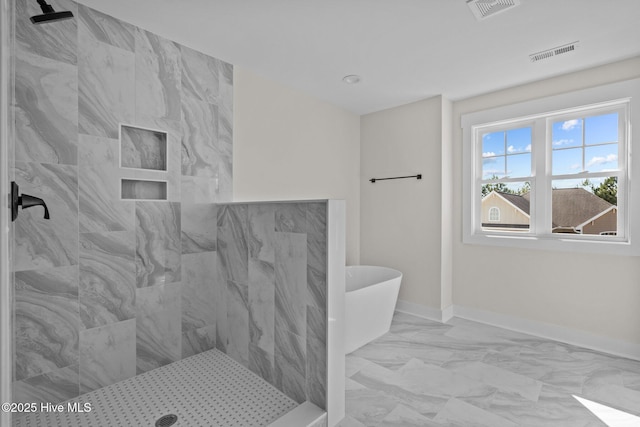 bathroom featuring shower with separate bathtub