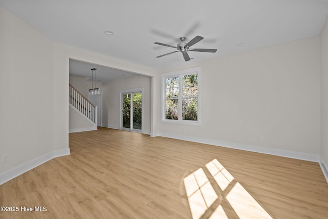 empty room featuring light hardwood / wood-style floors and ceiling fan