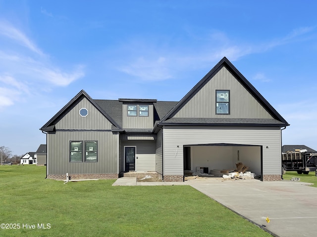 view of front of home featuring a garage and a front lawn